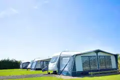 Fully serviced hardstanding touring pitches with space for awnings (12m x 6m)