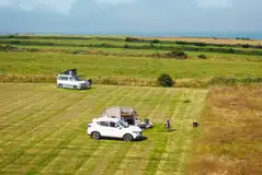Non electric grass pitch with space for a parked car