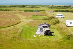 Secluded electric grass pitches (14m x 12m) at Shortlands Farm