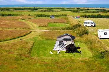 Secluded electric grass pitches (14m x 12m) at Shortlands Farm