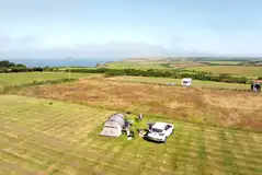 Large tent on a non electric grass pitch with space for a parked car Large tent on a non electric grass pitch with space for a parked car