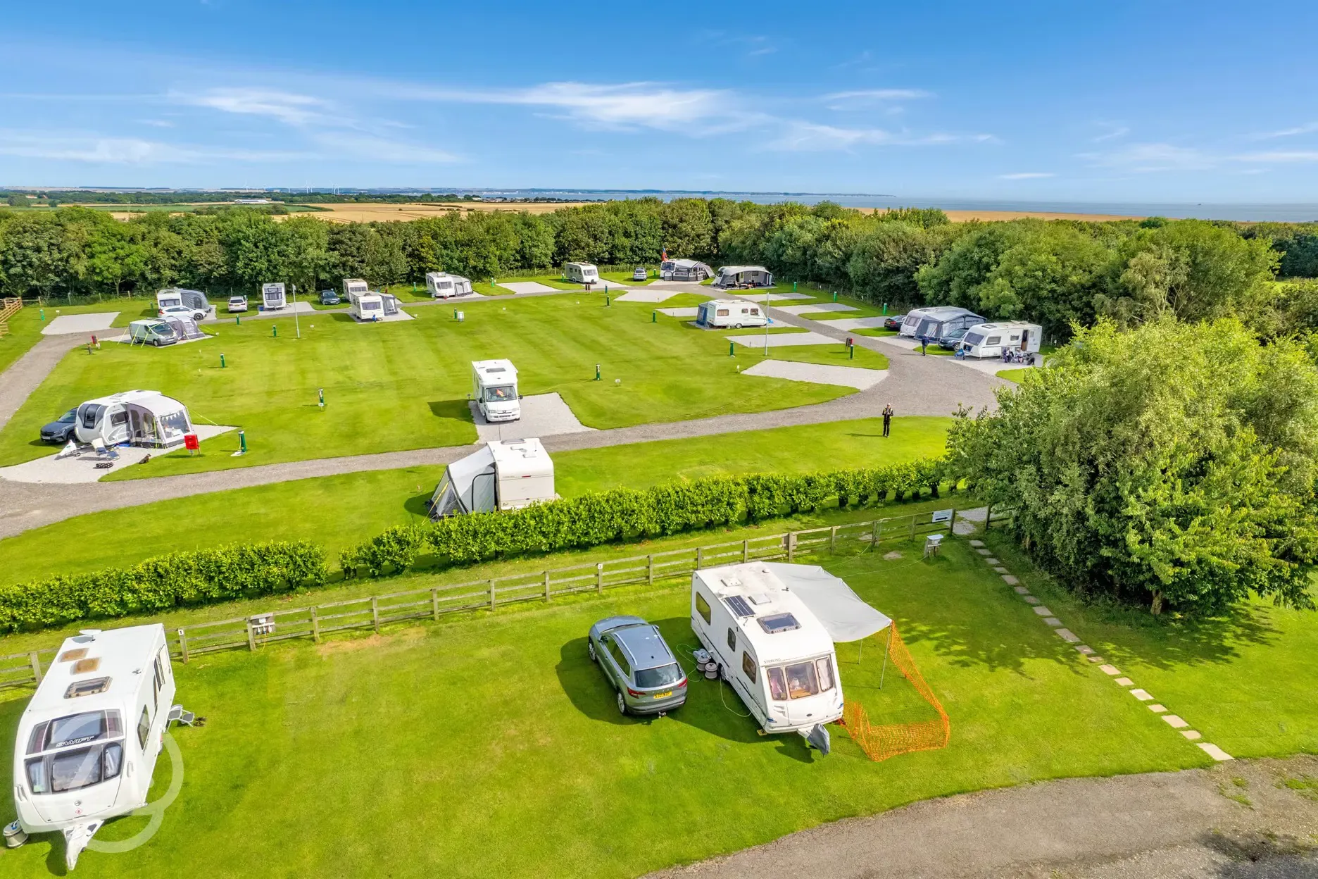 Aerial of grass and hardstanding touring pitches