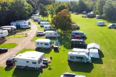 Aerial of grass pitches with awning space at Caravan Park at Stanford Hall