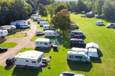 Aerial of grass pitches with awning space at Caravan Park at Stanford Hall