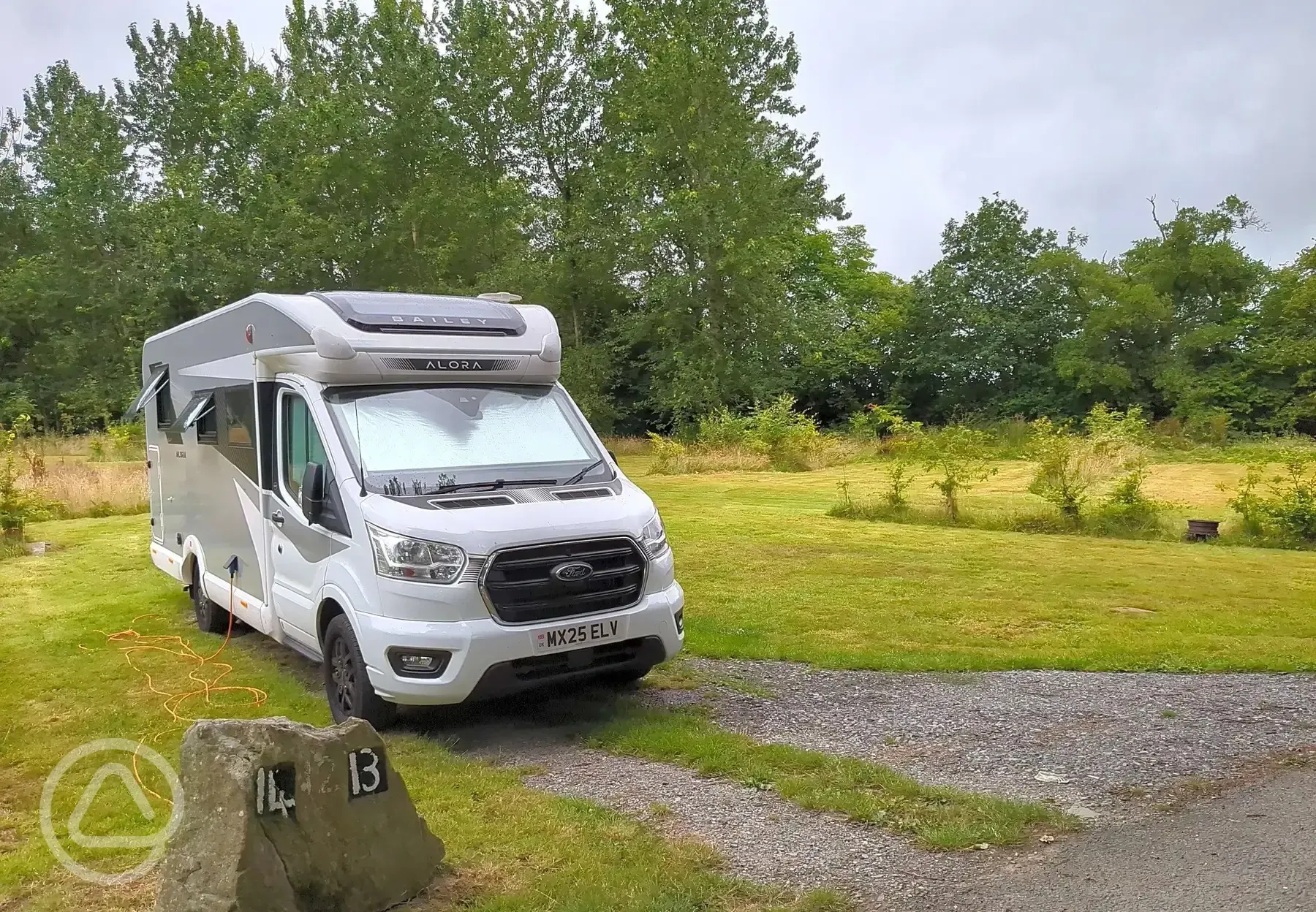 Motorhome on grass pitch with optional 10 amp hook up