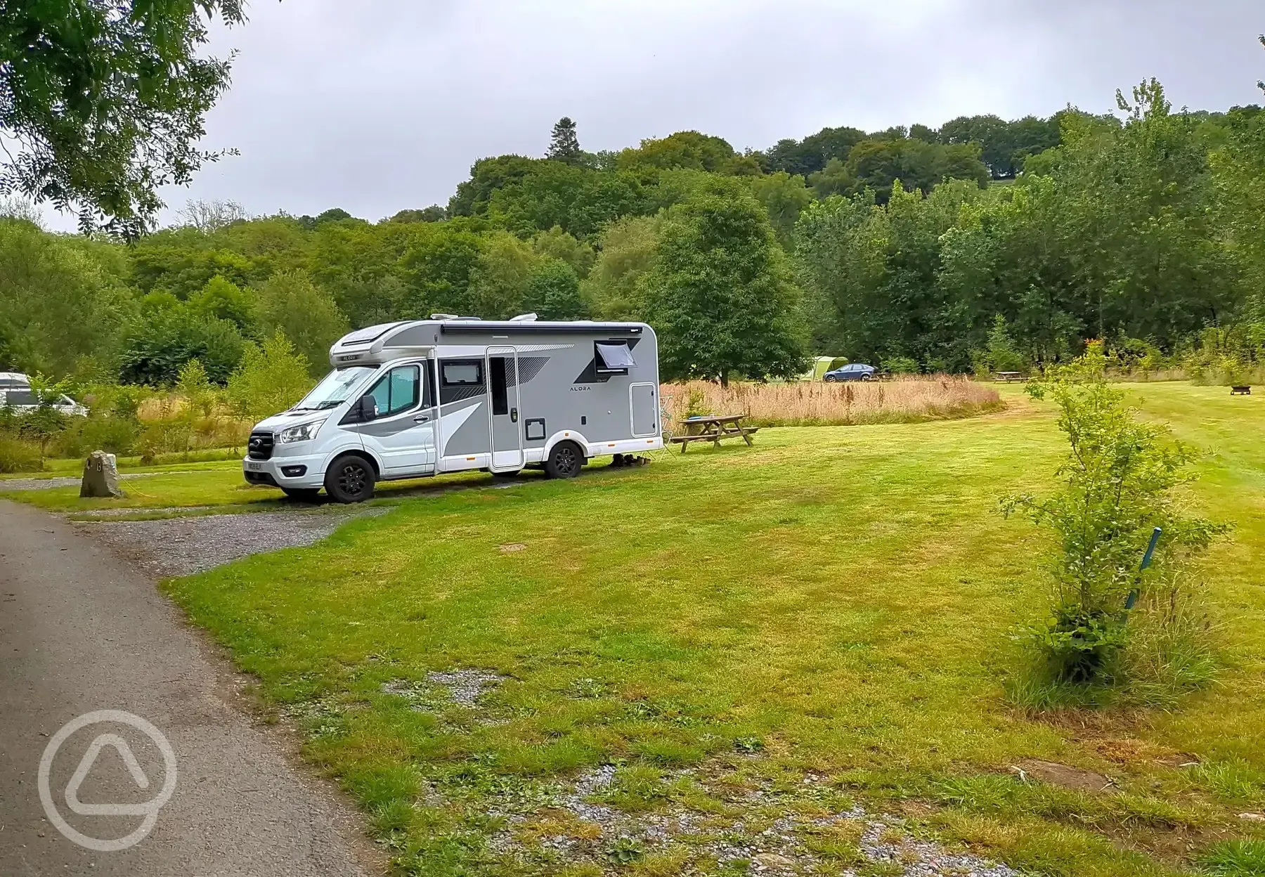 Motorhome on grass pitch with optional 10 amp hook up