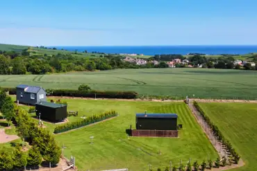 Aerial of the glamping area and sea views
