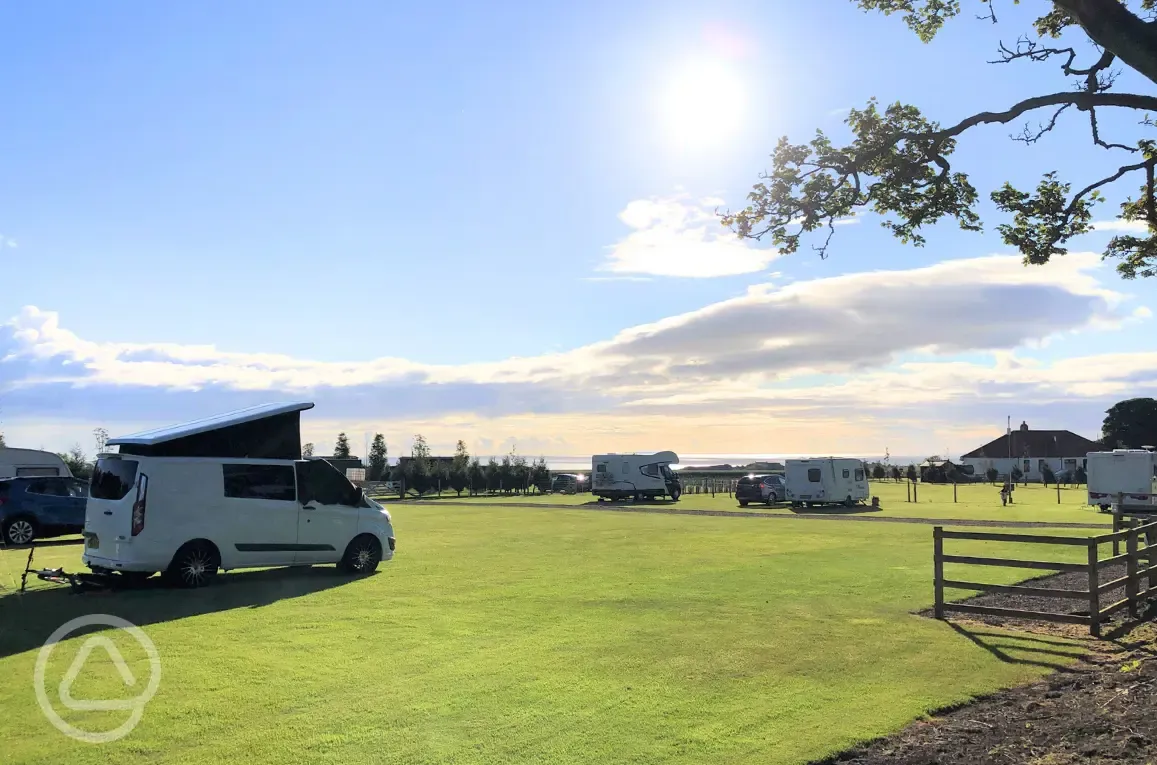 Fully serviced grass pitches and sea views