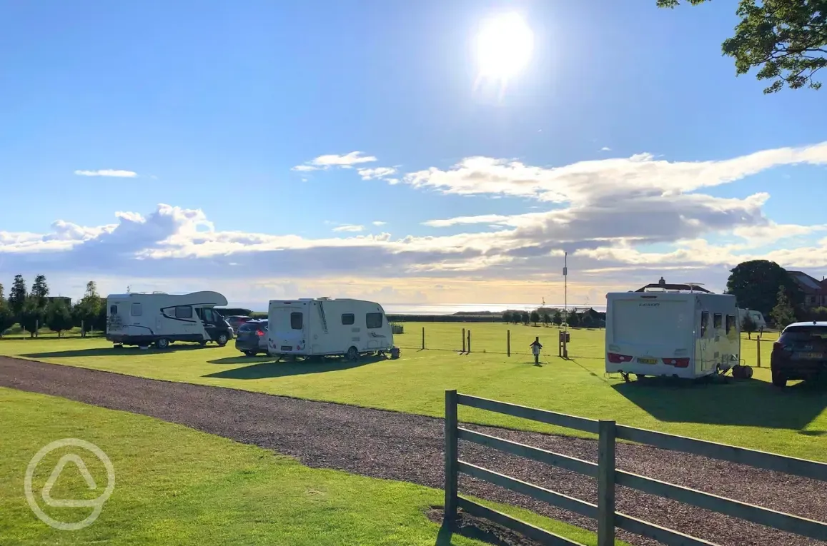 Fully serviced grass pitches and sea views