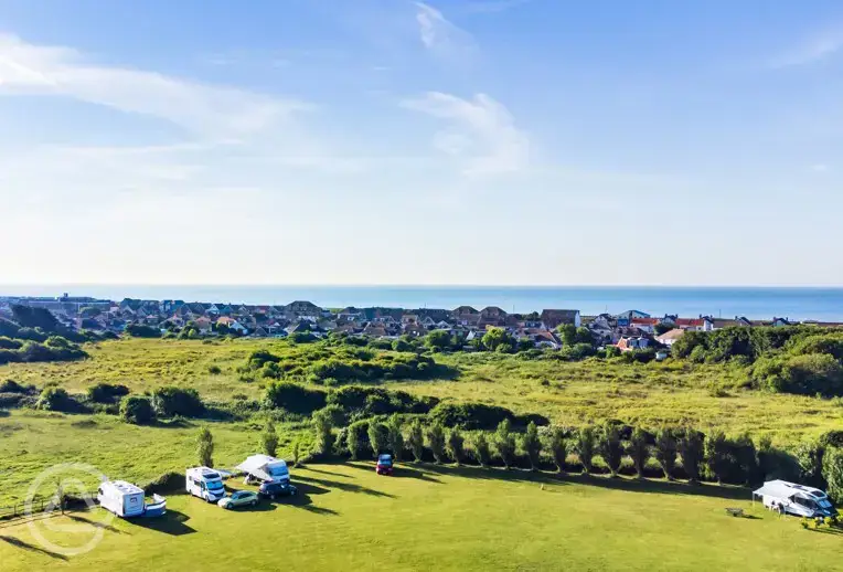 Aerial of campsite with sea views