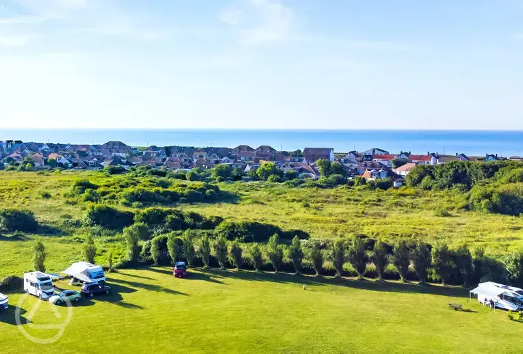 Aerial of campsite with sea views