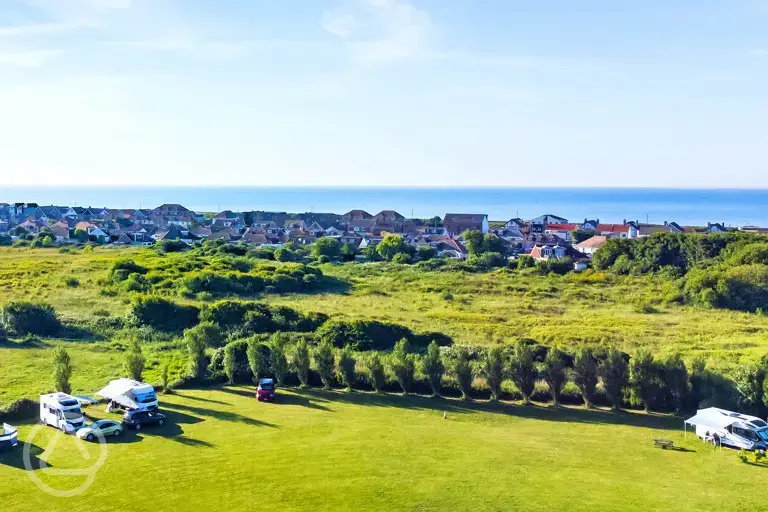 Aerial of campsite with sea views