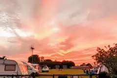 Sunset over the grass pitches at The Pretty Thing