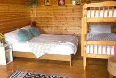 Large pod with a double bed and bunk beds Large pod with a double bed and bunk beds