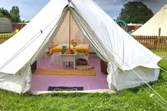 Large bell tent with a double bed and two camp beds Large bell tent with a double bed and two camp beds