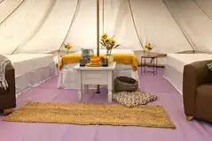 Large bell tent with a double bed and two camp beds Large bell tent with a double bed and two camp beds