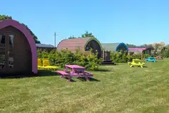 Camping pods with colourful picnic benches (four persons) Camping pods with colourful picnic benches (four persons)