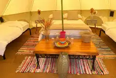 Large bell tent with a double bed and two camp beds Large bell tent with a double bed and two camp beds