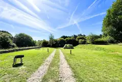 Non electric super grass pitches with a fire pit and picnic bench 