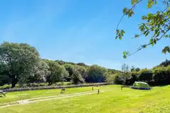 Non electric super grass pitches with a fire pit and picnic bench 