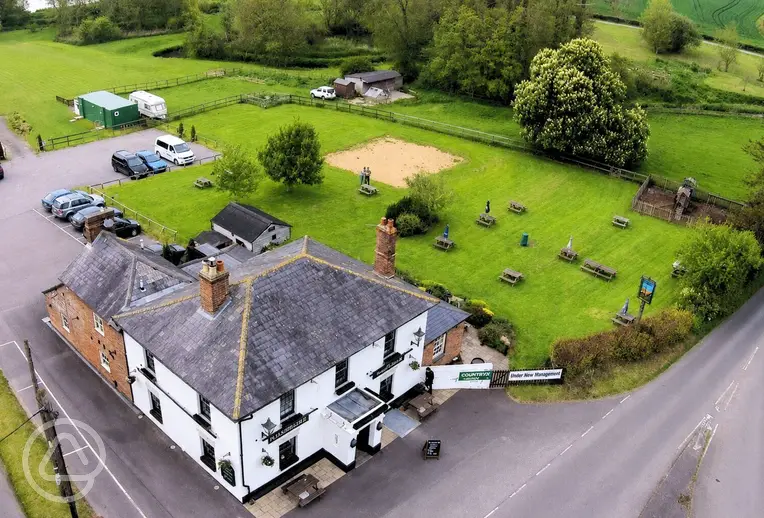 Aerial of Woodbridge Inn, grass and hardstanding pitches