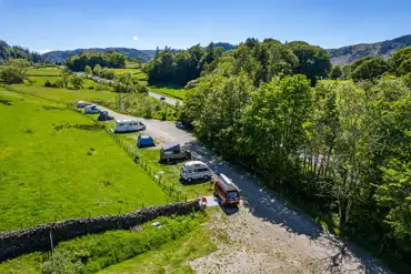 Non electric hardstanding pitches beside the A591 at Thirlspot Farm Camping
