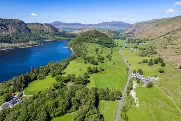 Aerial of Thirlspot Farm Camping with views of mountains and Thirlmere Reservoir