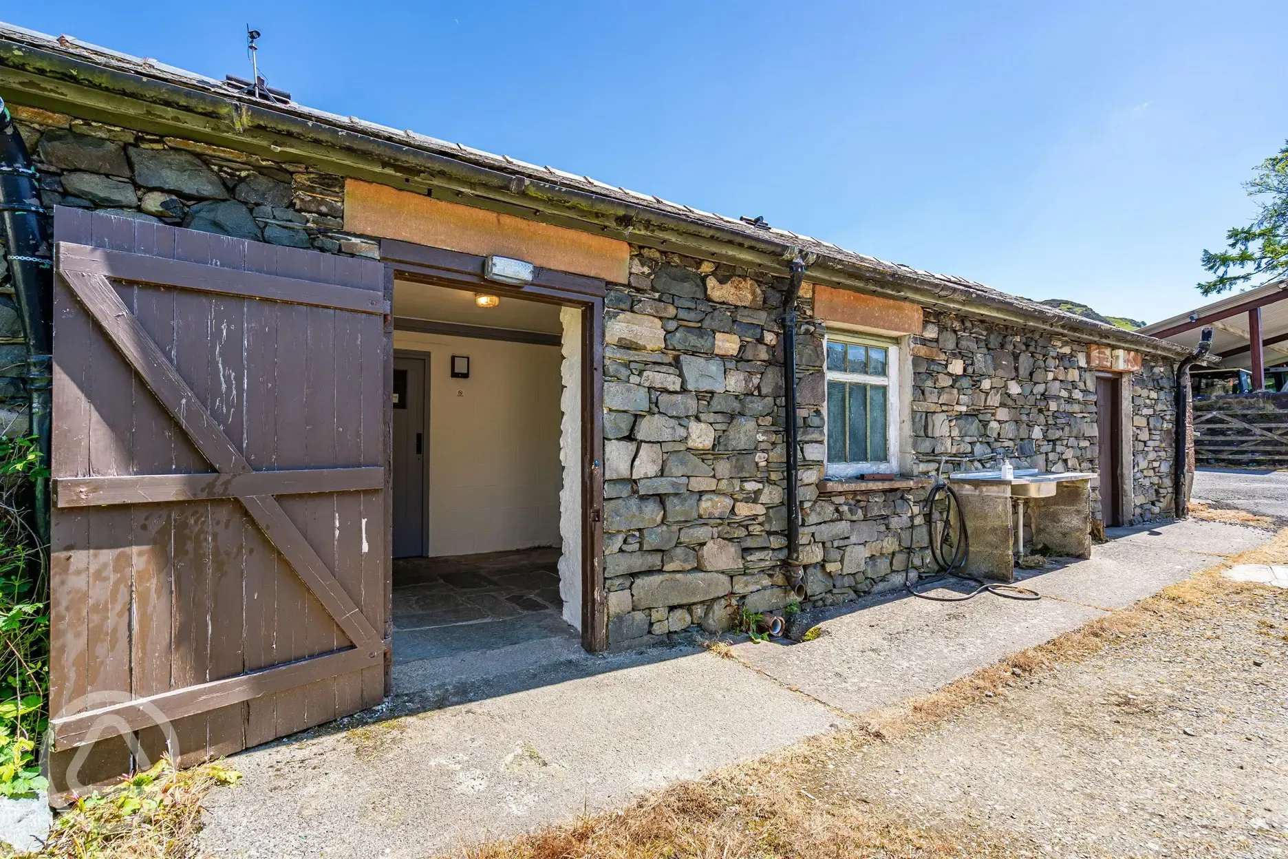 Facilities block with an outdoor washing up area