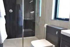 Ensuite glamping lodge bathroom with rainfall shower (towels and robes provided) Ensuite glamping lodge bathroom with rainfall shower (towels and robes provided)