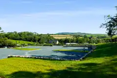 Fully serviced hardstanding pitches with fresh water tap, grey waste and hook up