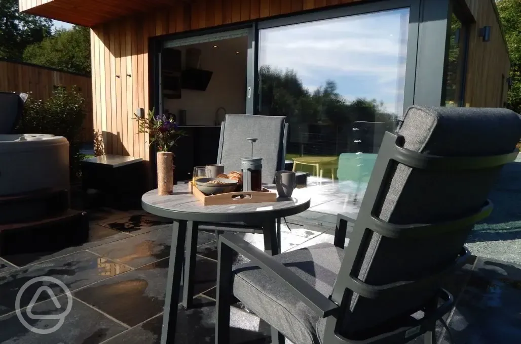Outdoor dining area of glamping lodge