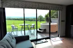 Ensuite glamping lodge living area with country views Ensuite glamping lodge living area with country views