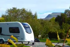 Fully serviced hardstanding pitches with views of the Yorkshire Dales