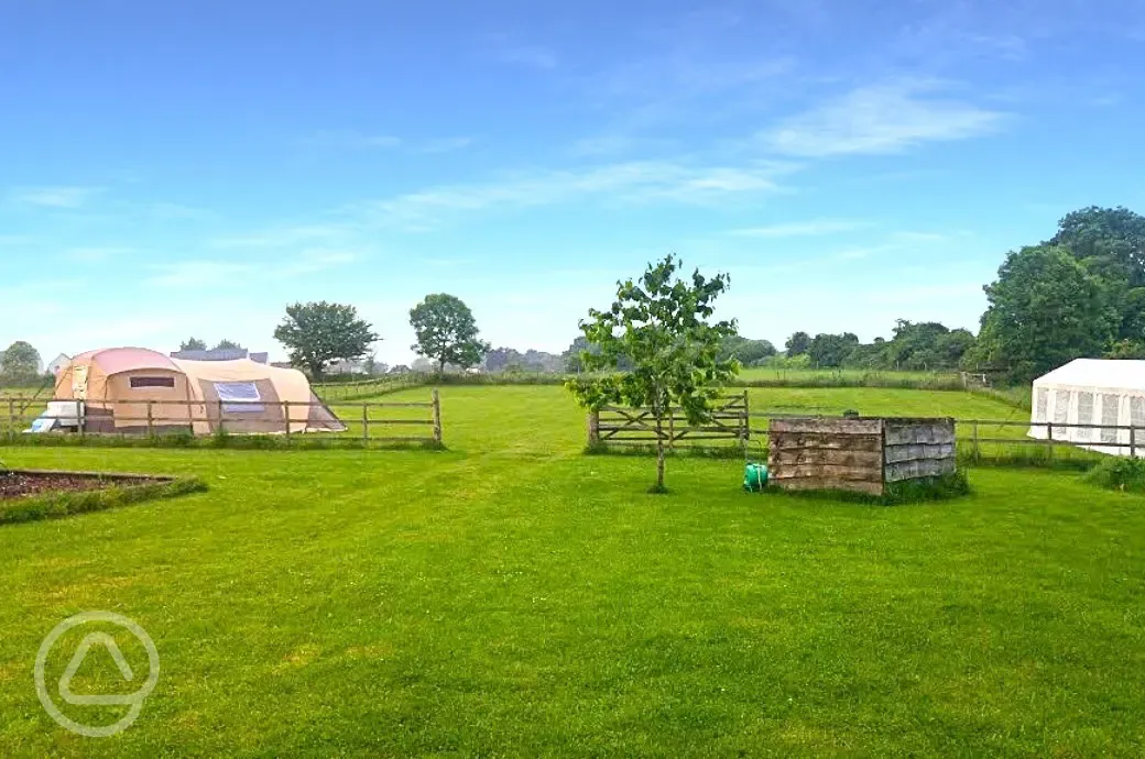 View to the Paddock field with a wooden fence