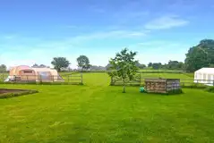 View to the Paddock field with a wooden fence