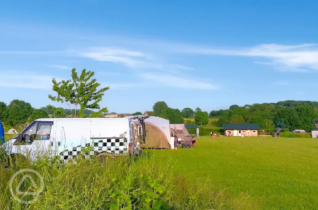 Spacious camping field with grass pitches (some with optional electric)