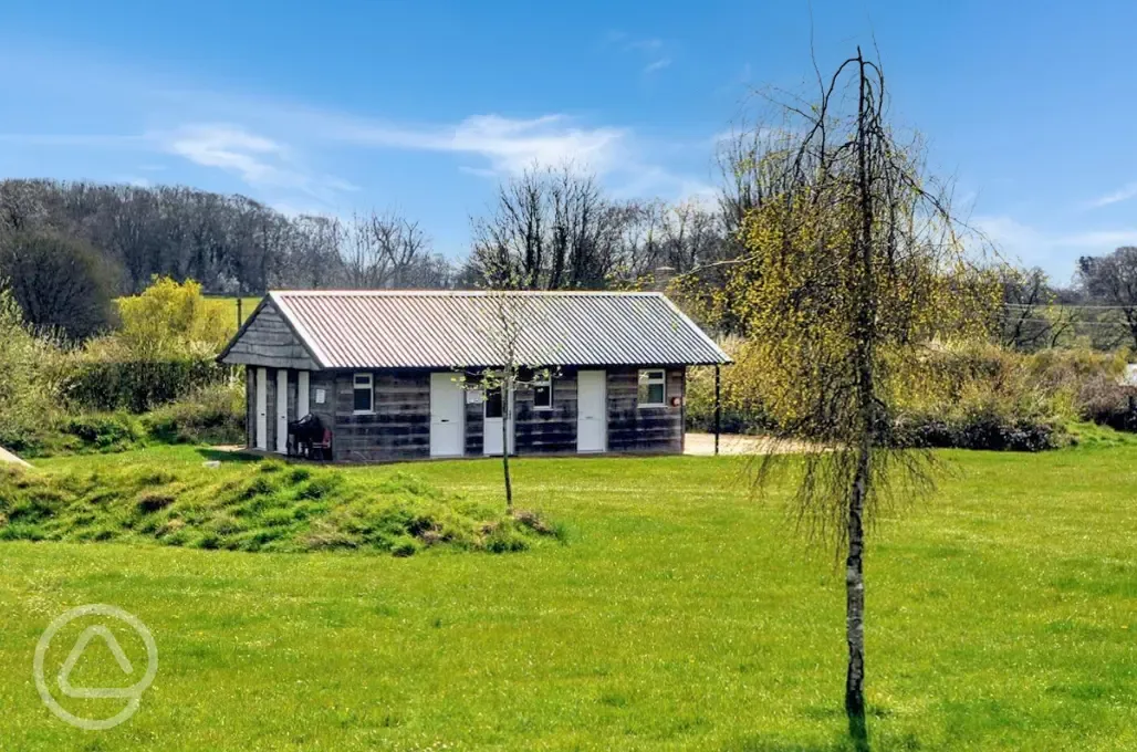 Facilities block with three separate bathrooms plus an accessible bathroom