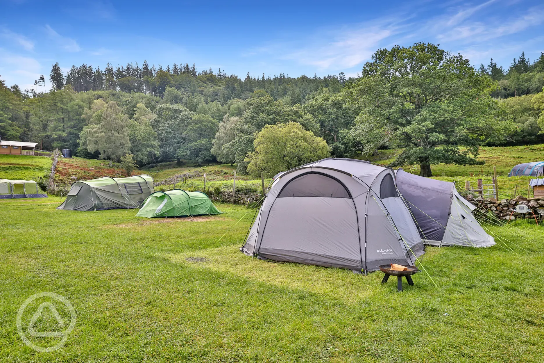Large tents on the electric grass pitches at Torrent Walk Campsite