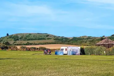 Non electric grass pitches with space for a parked car at Town Farm Camping