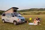 VW campervan on an electric grass pitch