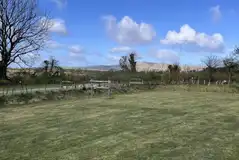 Electric grass tent pitches (8m x 8m)