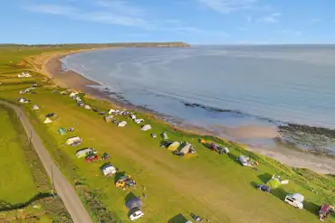 Aerial of campsite by the beach