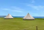 Bell tents with sea view, note that bedding and towels are not included
