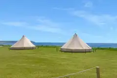 Bell tents with sea view, note that bedding and towels are not included