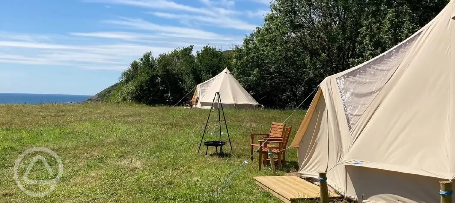 Stargazer bell tent (The Glade), with outdoor seating, firepit and sea views