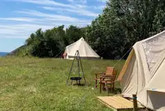 Stargazer bell tent (The Glade), with outdoor seating, firepit and sea views