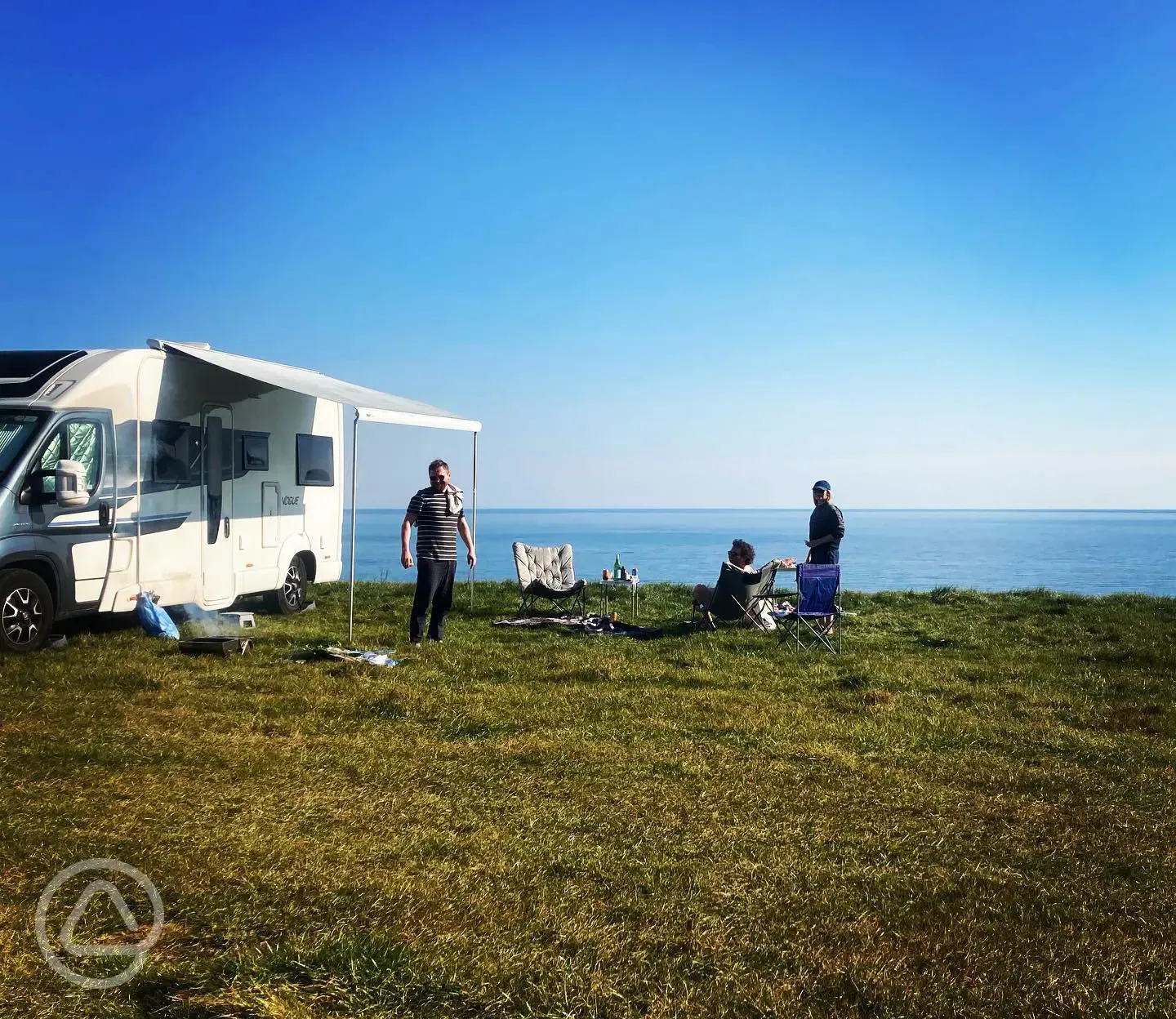 Non electric grass pitches with views of Hell's Mouth Bay 