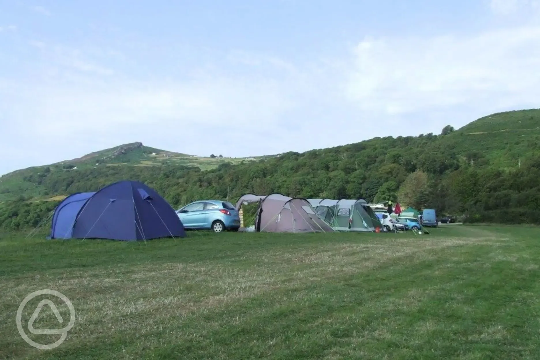 Non electric grass pitches with space to park one car alongside your pitch