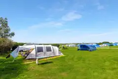 Large tents on the sheltered electric grass pitches with a 16 amp hook up