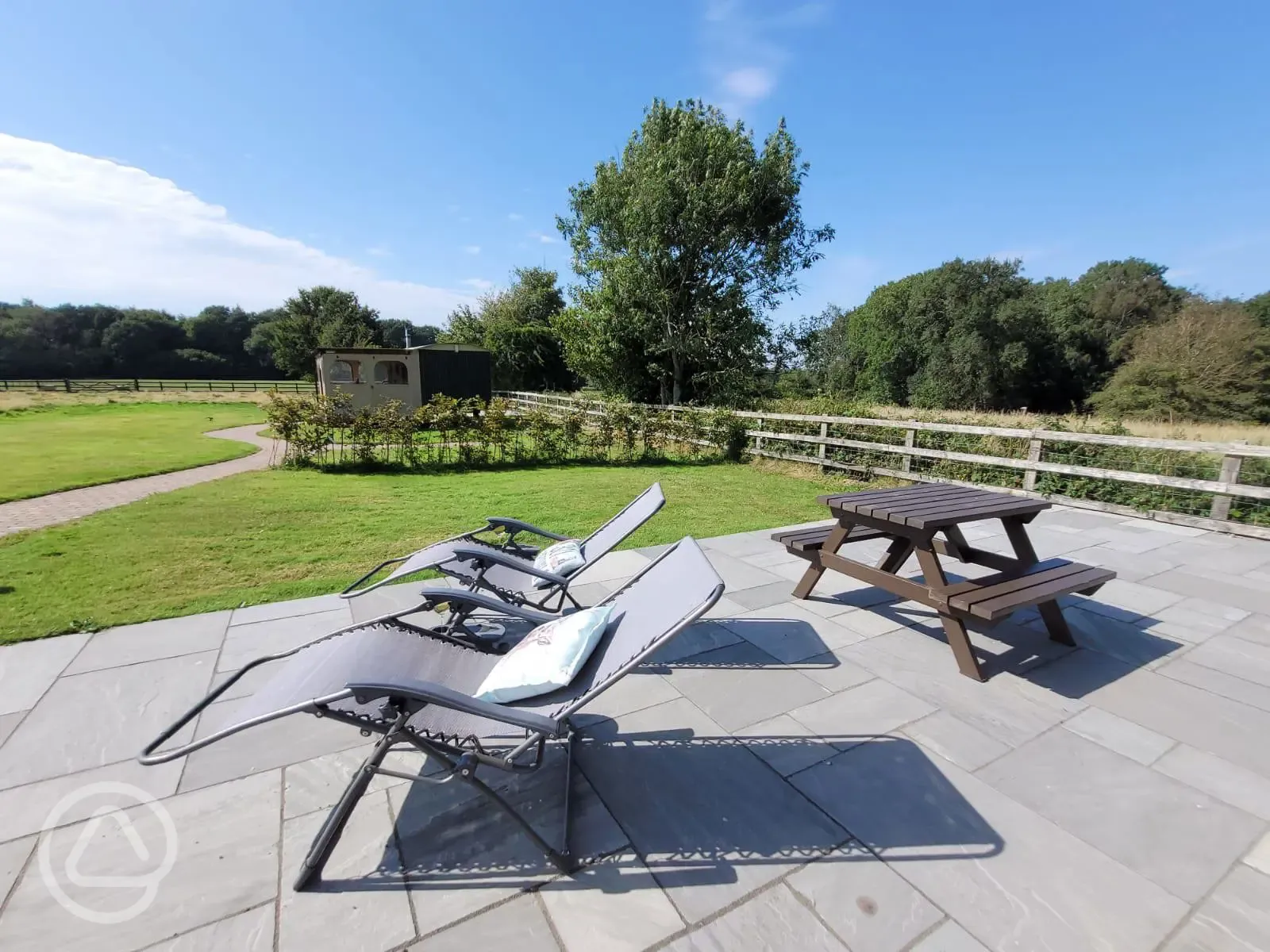 Your own patio with sunlounger chairs, table and BBQ stand 
